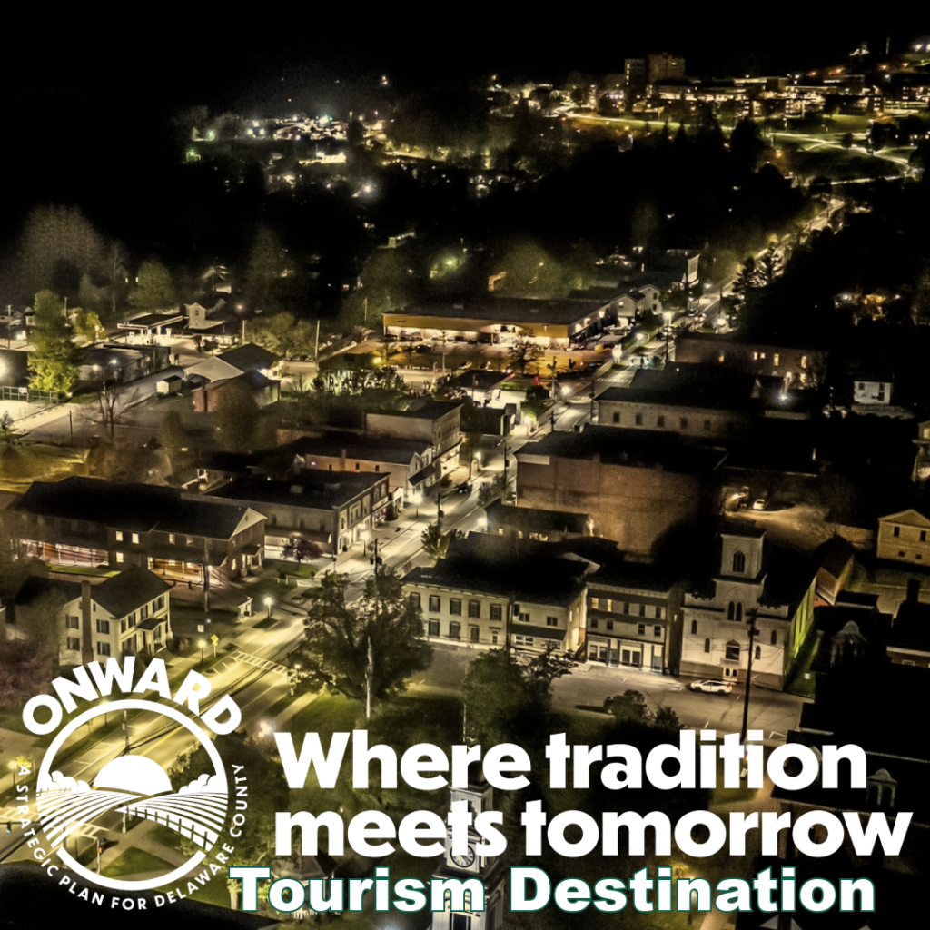 Brochure Why-7-#4 Overhead view of the Village of Delhi's Main Street at night.